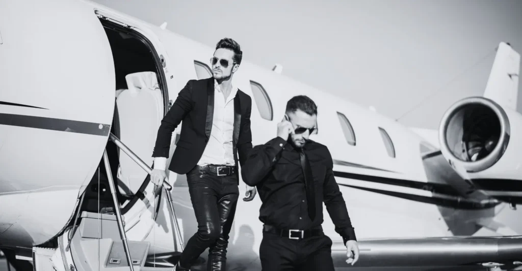 Elegant men coming from plane